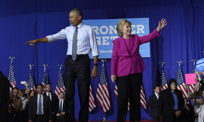 Obama says ready to 'pass the baton' to Clinton