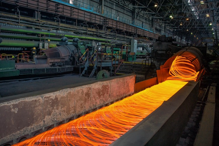 Wire rod being shaped at an ArcelorMittal steel factory in Ukraine