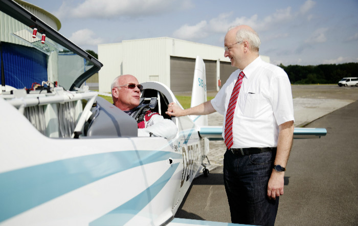 The battery-powered Extra 330LE aerobatic plane was developed in a collaborative effort between Siemens and Extra Aircraft. Pictured are Walter Extra (left), Extra Aircraft's founder, and Frank Anton, head of eAircraft at Siemens Corporate Technology.