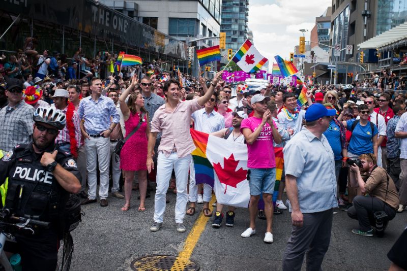 Canadian Prime Minister Justin Trudeau (middle, holding flag) participates at the annual Pride