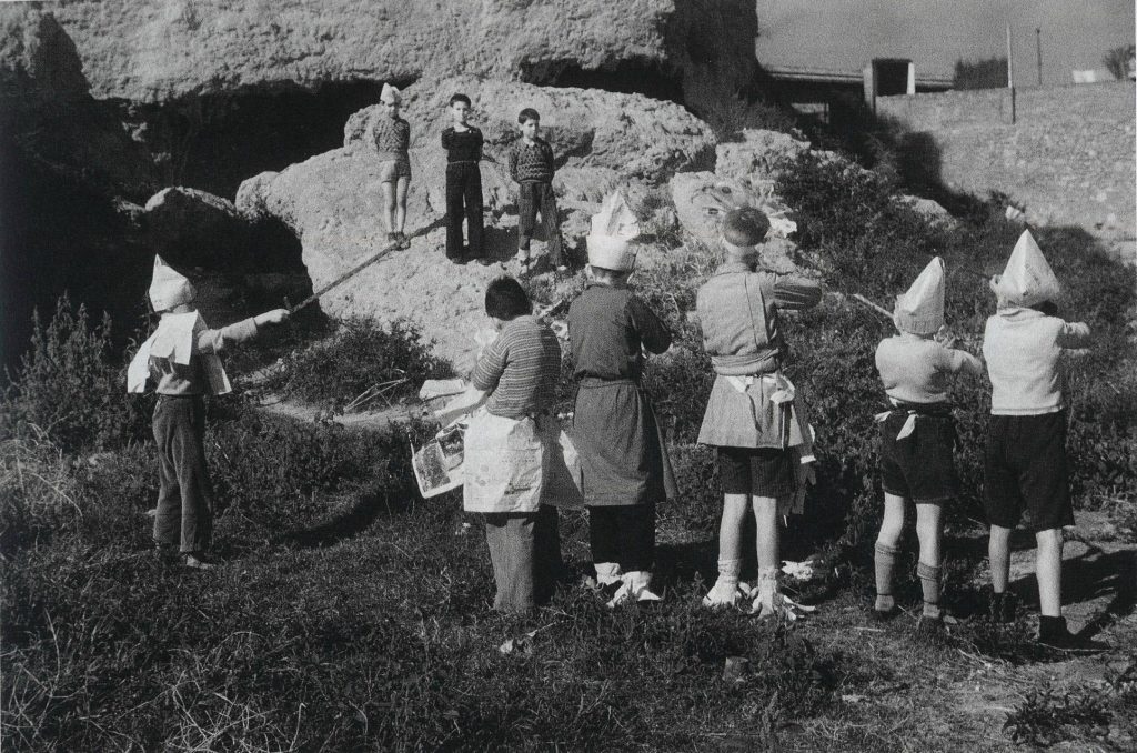 Children in Barcelona pretending to be a firing squad at the dawn of the Spanish Civil War