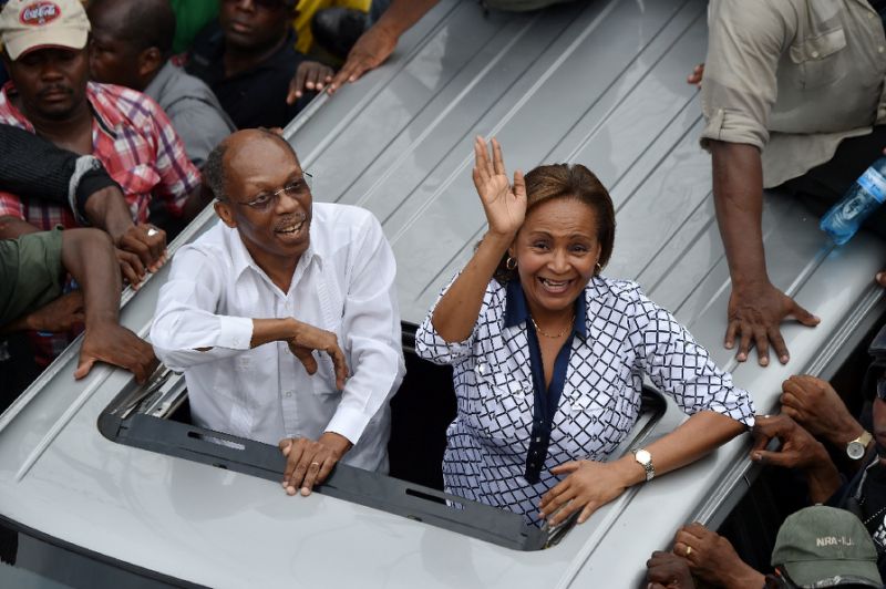 Presidential candidate from the Famni Lavalas party, Marysse Narcisse, takes a campaign drive with former president Jean Bertrand Aristide in in Port-au-Prince, Haiti on August 29, 2016