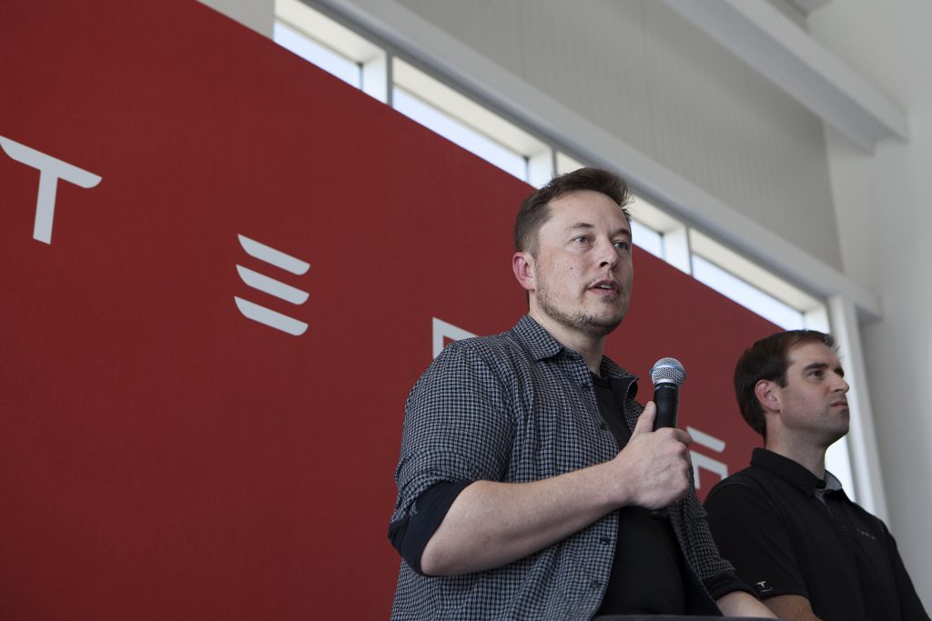 Tesla CEO Elon Musk speaks during a press event at Tesla's Gigafactory