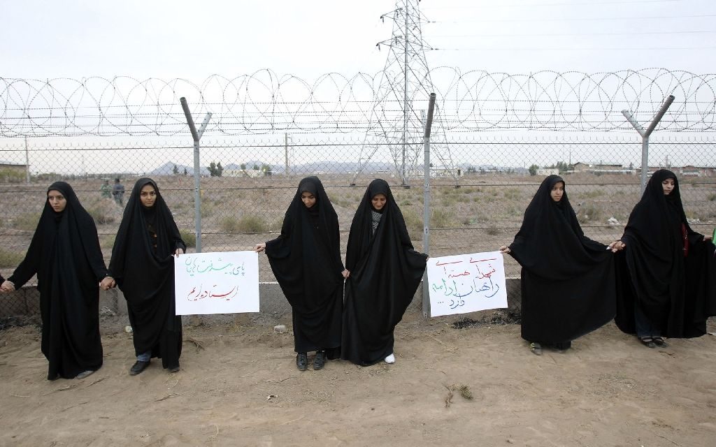 Iranian students form a human chain during a protest to defend their country's nuclear program outside the Fordo Uranium Conversion Facility in Qom in 2013