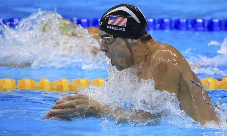 Michael Phelps (USA) of USA competes on the way to winning the gold medal.  REUTERS/Dominic Ebenbichler