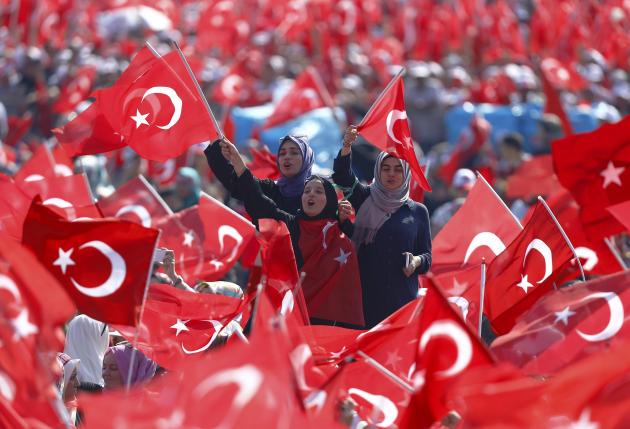 People wave Turkey's national flags during the Democracy and Martyrs Rally, organized by Turkish President Tayyip Erdogan and supported by ruling AK Party (AKP), oppositions Republican People's Party (CHP) and Nationalist Movement Party (MHP), to protest against last month's failed military coup attempt, in Istanbul, Turkey, August 7, 2016.  REUTERS/Osman Orsal