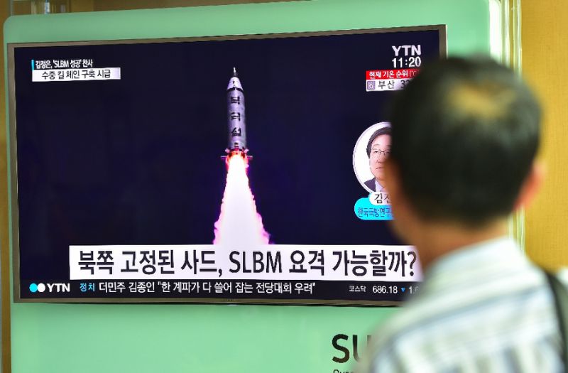 A  man watches a television screen reporting news of North Korea's latest submarine-launched ballistic missile test at a railway station in Seoul on August 25, 2016