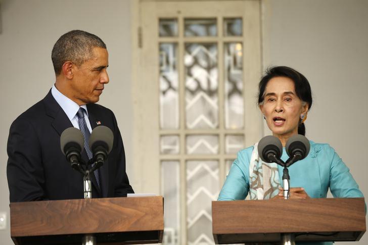 U.S. President Barack Obama and opposition politician Aung San Suu Kyi hold a press conference after their meeting at her residence in Yangon, November 14, 2014