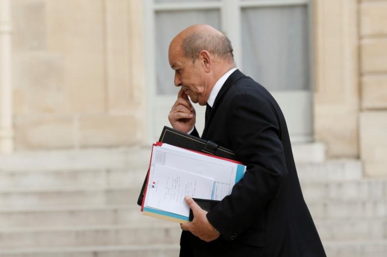 French Defence Minister Jean-Yves Le Drian arrives to attend a defence council  at the Elysee Palace in Paris