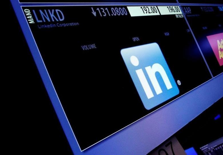 The ticker symbol and trading information for LinkedIn Corp. is displayed on a screen at the post where it is traded, before the start of trading, on the floor of the New York Stock Exchange (NYSE) in New York City, U.S., June 13, 2016