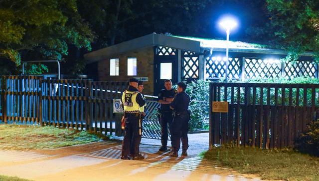 Police investigate the scene after the shooting in Malmo