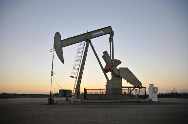 A pump jack operates at a well site leased by Devon Energy Production Company near Guthrie