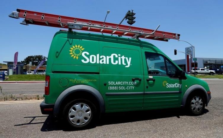 A SolarCity vehicle is seen on the road in San Diego, California, U.S. 