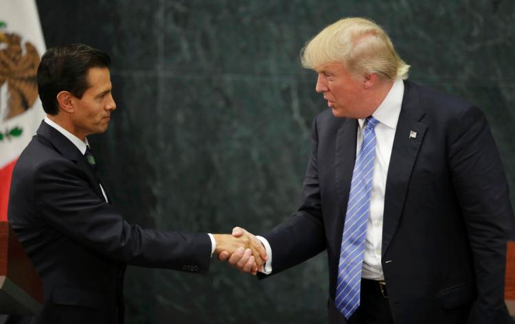 Donald Trump shakes hands with Mexican President Enrique Peña Nieto after a joint statement