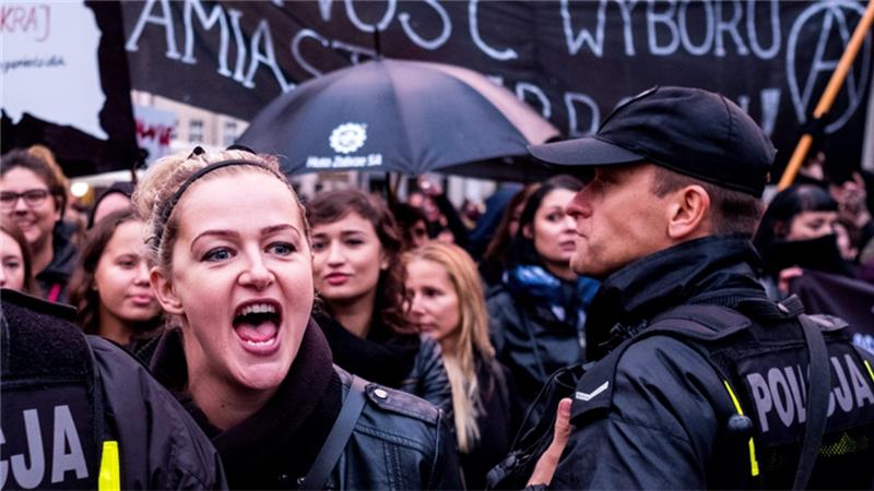 Protesters gather on the streets during the nationwide women strike in Katowice, Poland on Monday 