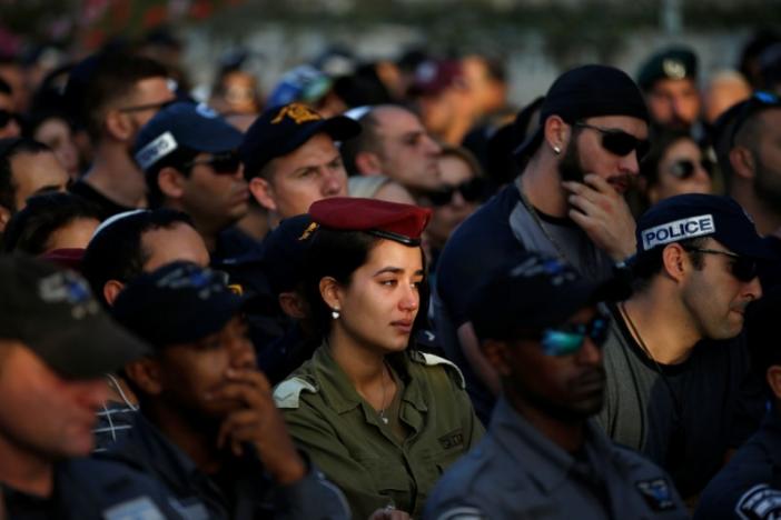 Family and friends mourn during the funeral of Israeli policeman Yosef Kirma, who was killed by a Palestinian assailant who fired from a car before being shot dead by Israeli police in Jerusalem, at Mount Herzl cemetery in Jerusalem 