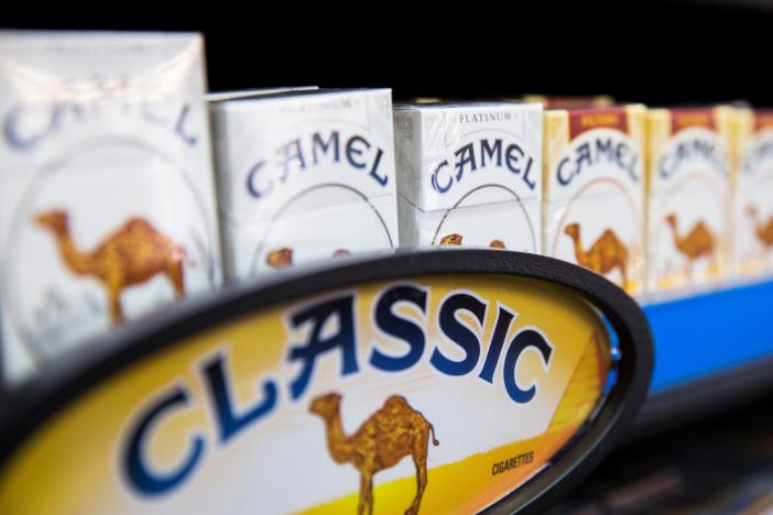 Camel cigarettes are stacked on a shelf inside a tobacco store in New York 