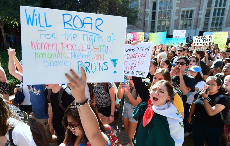 In Los Angeles, several hundred students marched at the University of California campus carrying placards that read “Dump Trump” and “Love trumps hate”
