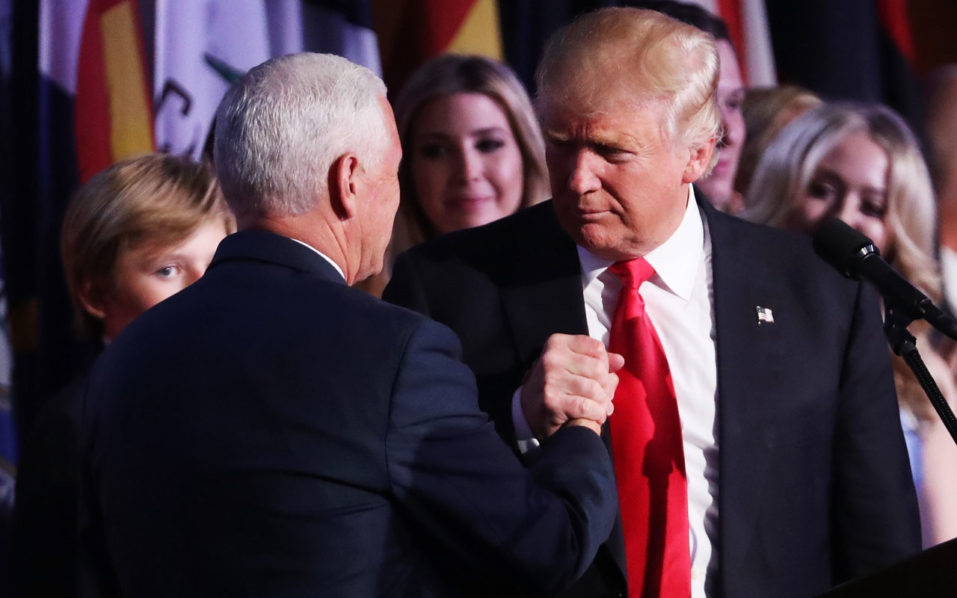 Vice president-elect Mike Pence and Republican president-elect Donald Trump shake hands during his election night event at the New York Hilton Midtown in the early morning hours of November 9, 2016 in New York City