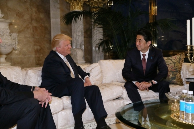 Japan's Prime Minister Shinzo Abe meets with US President-elect Donald Trump at Trump Tower in Manhattan, New York