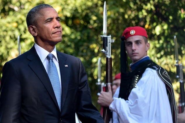 US President Barack Obama inspects the presidental guard in Athens on November 15, 2016