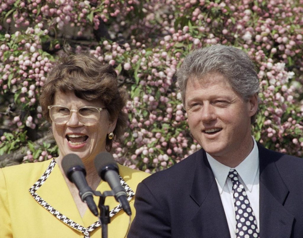 Janet Reno, the first female United States Attorney General, stands with former US President Bill Clinton in the Rose Garden of the White House on April 15, 1993