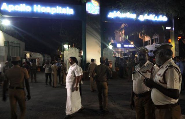 Indian policemen stand in front of a hospital where Chief minister of the Indian state of Tamil Nadu Jayaram Jayalalitha was being treated in Chennai 