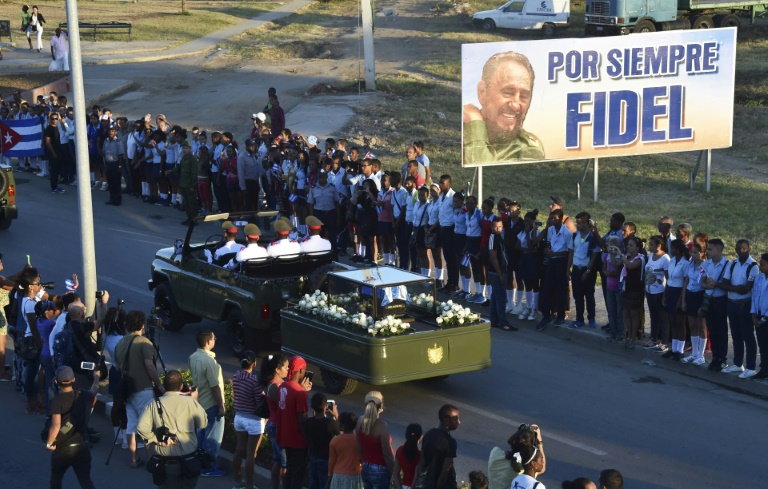 As a military jeep drove Fidel Castro’s urn thousands who lined the streets of Santiago shouted “viva Fidel!”