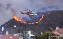 Wildfire sparks panicked evacuations in Los Angeles suburb