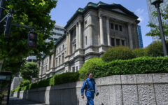 Bank of Japan holds rates, says to slow bond purchase taper
