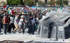 Clashes injure 120 at protest against Mexico president