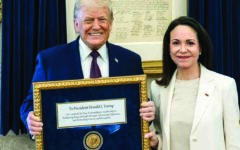 Venezuelan Nobel Peace Prize winner presents her medal to Trump
